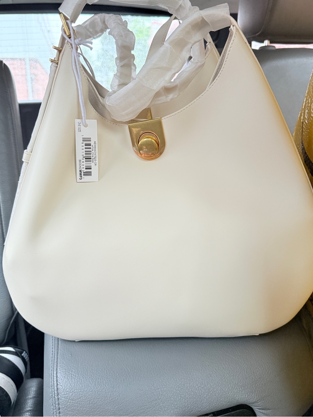 Elegant Cream Shoulder Bag with Gold Accent